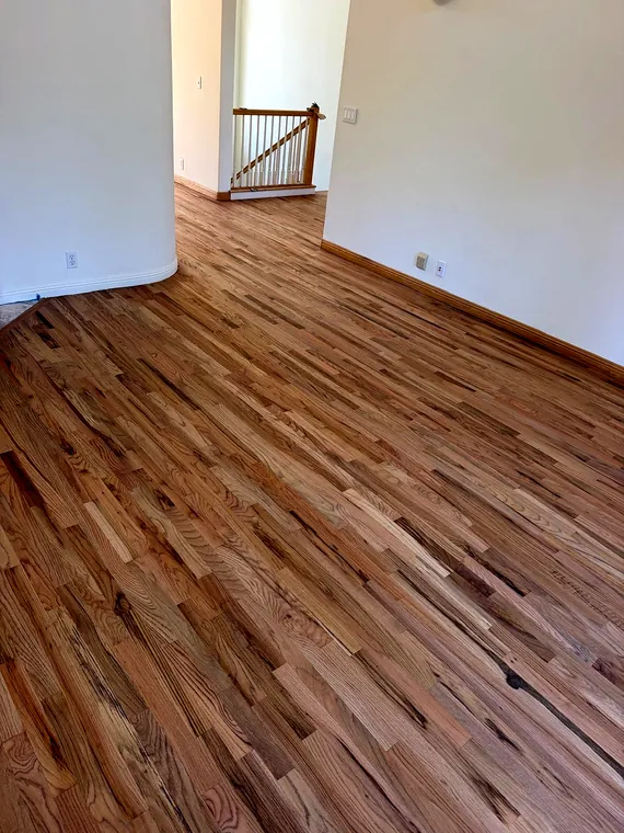 Completed wood flooring in a bright residential room