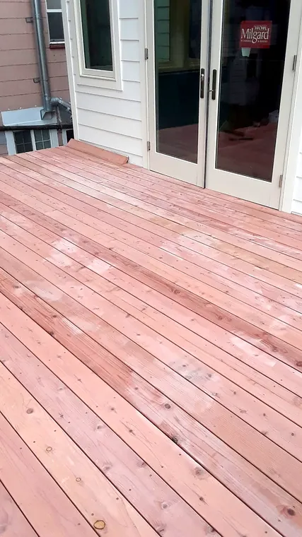 Newly installed natural wood deck boards