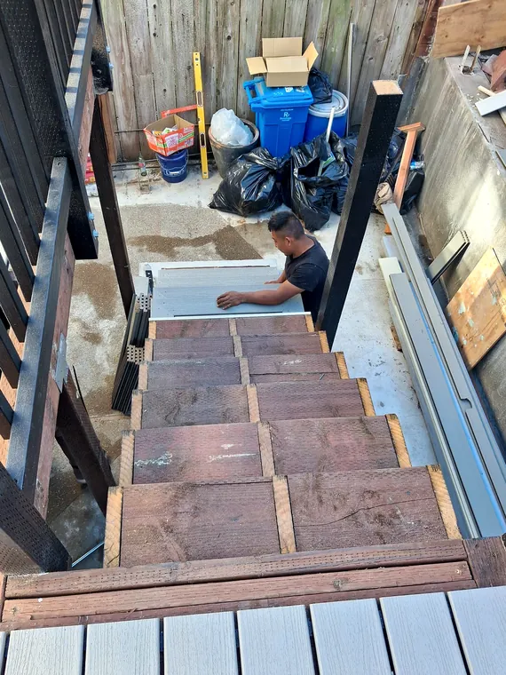 Tile installation in progress on an exterior staircase