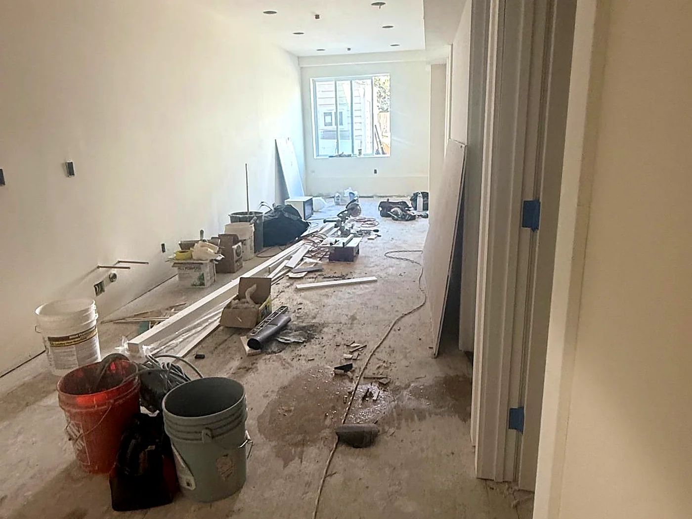 Residential interior renovation in progress with tools and materials on site